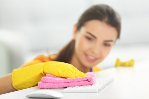 Cleaner vacuuming carpets as part of move out cleaning